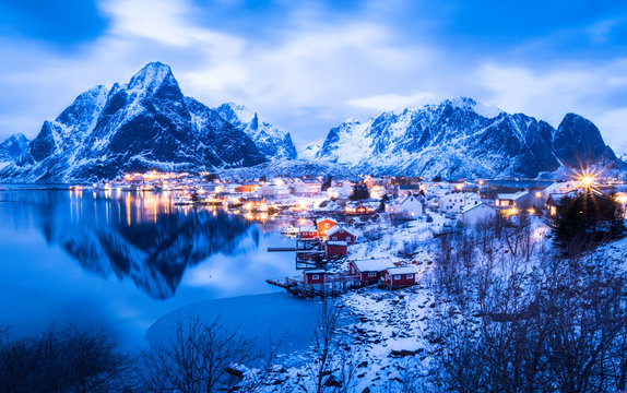 amous tourist attraction Reine on Lofoten Islands, Norway, in twilight winter season.