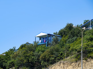 Houses on the mountain for tourists. A house among the trees.