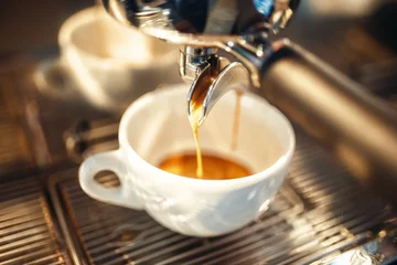 Foto op Plexiglas Coffee machine pours foam into the cup closeup © Nomad_Soul