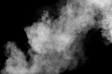 Fototapeta premium Bizarre forms of white powder explosion cloud against black background.
