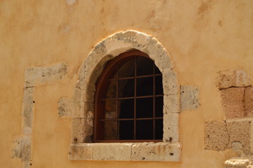 Fototapeta na wymiar Beautiful Window Of An Old House In The Venetian Quarter In Chania. History Architecture Travel. July 6, 2018. Chania, Crete Island. Greece.