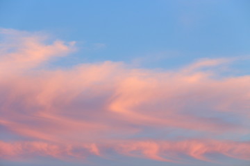 Naklejka na ściany i meble Beautiful sunset sky. Beautiful clouds on a blue sky.