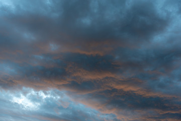 Fototapeta na wymiar Thunderstorm cloudscape on fire at sunset