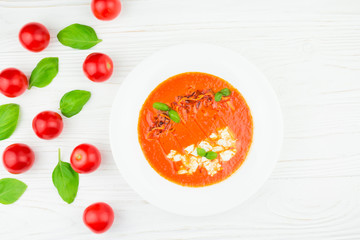 tomato soup on a white wooden background