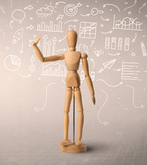 Wooden mannequin posed in front of a greyish background with white scribbled data around him