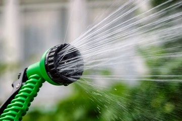 Garden sprinkler for irrigation plants with jets of water. Frozen motion