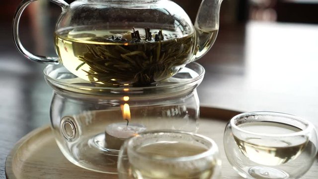 Beautiful flower tea serve in glass pot and cup video