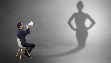 Rich businessman staying and offering stuffs to a pretty shadow woman
