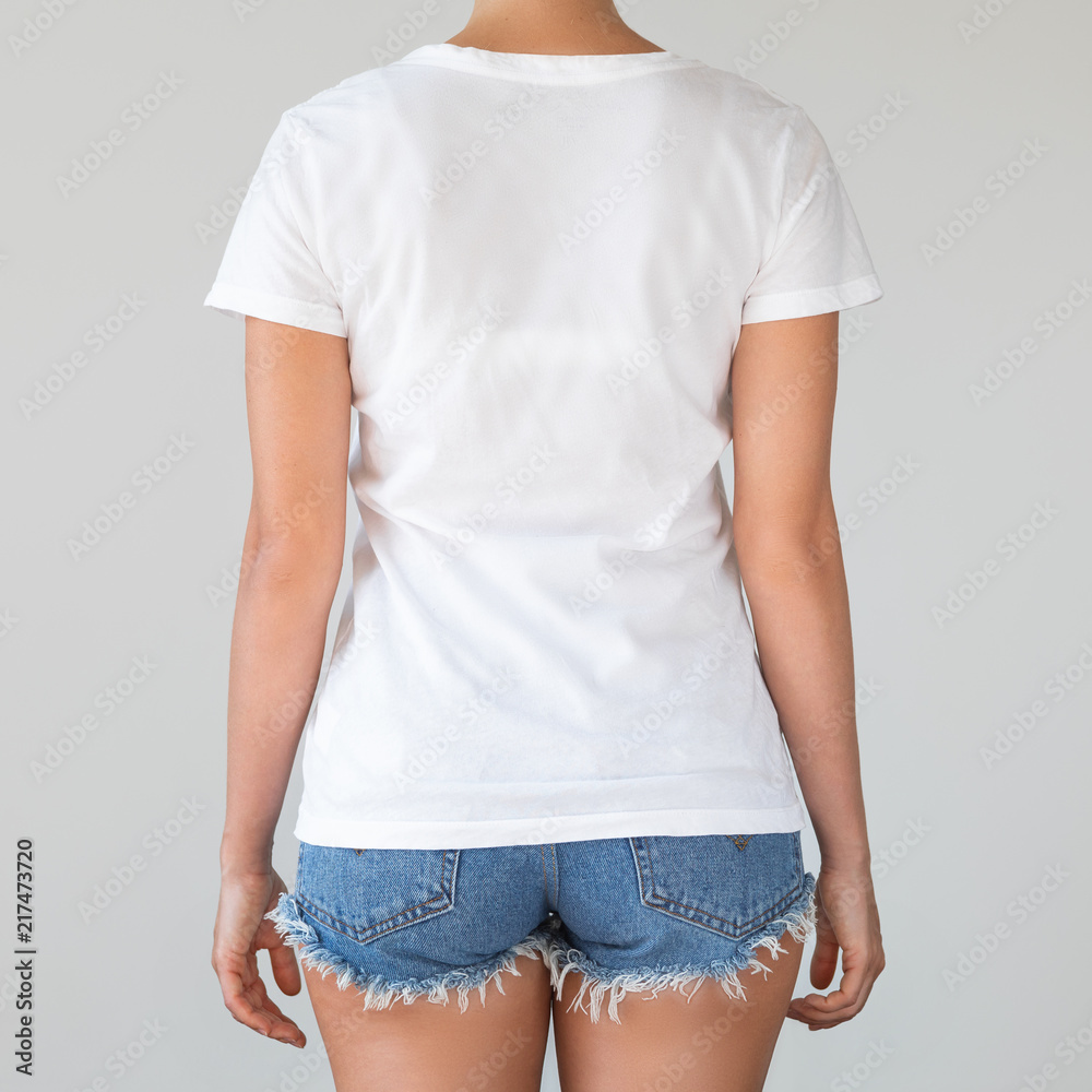 Wall mural Woman wearing cotton white shirt with empty space for your text or logo