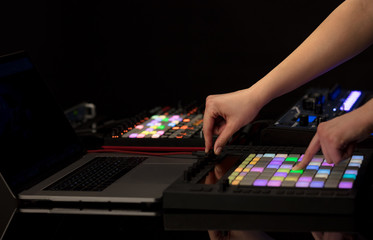 Fototapeta premium Dj hand remixing music on midi controller 