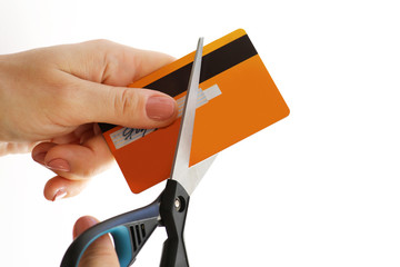 Woman cutting her credit card with a scissors