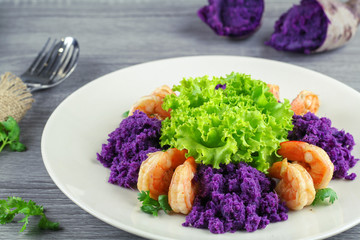 Grilled shrimp with mashed sweet potato and green lettuce