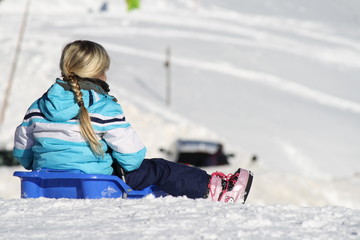 bob on the snow, a litte girl playing