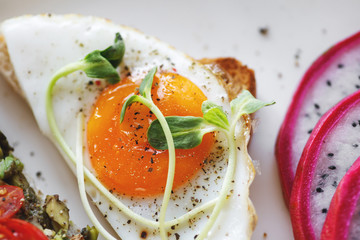 Toast with fried egg for breakfast