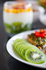 Slices of fresh and ripe kiwi fruit on the plate