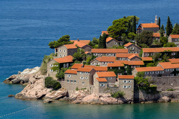 Fototapeta na wymiar Sveti Stefan island in Budva in a beautiful summer day, Montenegro