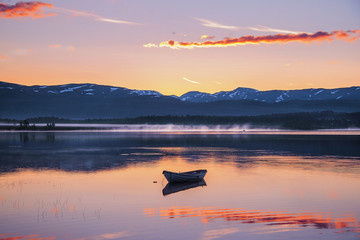 Boat in the lake near polar circle, Senja island, Norway