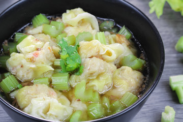 wonton clear soup with celery, traditional asian food