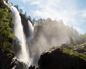 Water spraying around waterfall in Norway