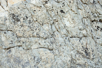 Texture of layered stone in mountainous terrain