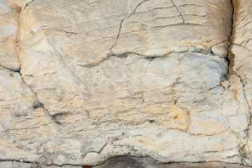 Texture of layered stone in mountainous terrain