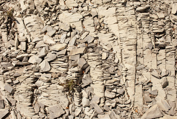 Texture of layered stone in mountainous terrain
