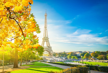 view of Eiffel Tower landmark from Trocadero at fall sunrise, Paris, France, toned