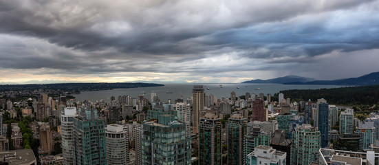 Aerial panoramic view of Downtown City during a stormy summer evening before sunset. Taken in Vancouver, British Columbia, Canada.