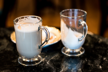 Espresso, Cappuccino And Latte In Glass Mugs On Dark Table At Diner