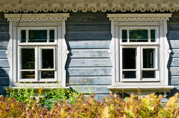 Fototapeta na wymiar Wooden windows of cottage