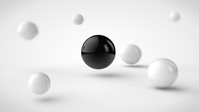 the image of groups of balls with different depth of field, white drop shadow, and randomly located in space, and one black ball in the center, on a white background. 3D rendering.