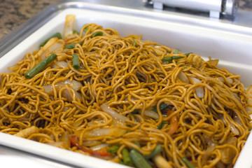 Cooked noodles with vegetables in soy sauce