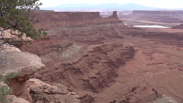 Mountain landscape of red erosion rocks and salt lake in Canyonlands National Park, Utha