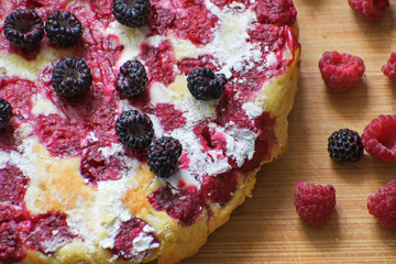 Cheesecake with raspberries and blackberry close-up. Light breakfast.