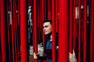 Conceptual portrait of young man with red lines