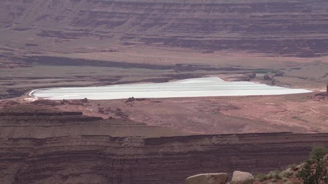 Mountain landscape of red erosion rocks and salt lake in Canyonlands National Park, Utha