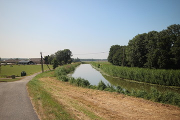 Fields, roads,bicycle lanes and canals along the dyke of the Hollandsche IJssel in Moordrecht, the Netherlands/