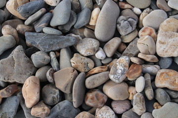 Gravel and stones in all kind of sizes at the beach shore of the Maasvlakte in Rotterdam, Netherlands.