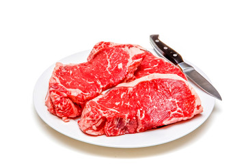 Plate of Steaks and Knife