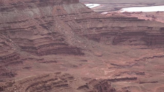 Mountain landscape of red erosion rocks and salt lake in Canyonlands National Park, Utha