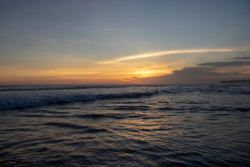 Naklejka na ściany i meble Sunset over sand beach of Changgu area Echo beach,Bali island,Indonesia