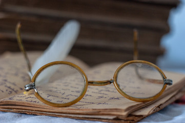 old vintage glasses lie on a diary