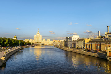 Moskvoretskaya and Raushskaya embankment of Moscow river. View towards stalinist residential skyscraper 1938-1952 years of construction on Kotelnicheskaya embankment in Moscow.