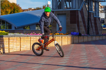 professional BMX rider made tricks on bicycle 