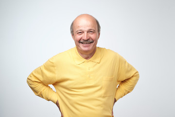 Portrait of mature european man looking at camera and smiling.