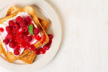 Healthy breakfast toasts with raspberry and cottage cheese