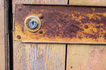 wooden old door with a lock. Background