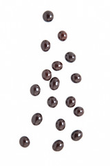 Espresso chocolate balls falling isolated on white background.