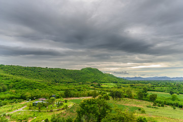 Obraz premium Landscape of cloudy, mountain and forest with sunset in the evening from top view.
