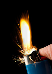 Naklejka premium Butane lighter igniting